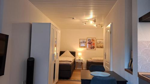 a small room with a bed and a bedroom at Apartment 2 Unter den Eichen in Tätendorf-Eppensen