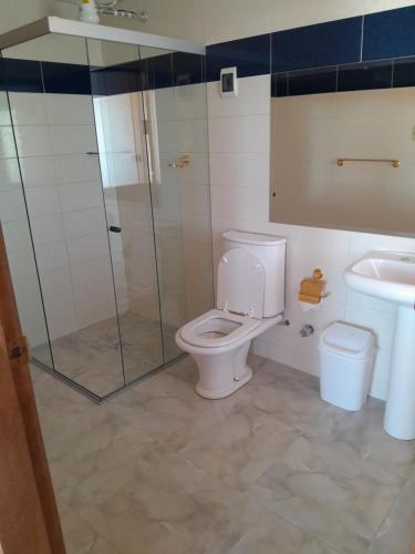 a bathroom with a shower and a toilet and a sink at Casa de la Luna - ISLA DEL SOL in Comunidad Yumani