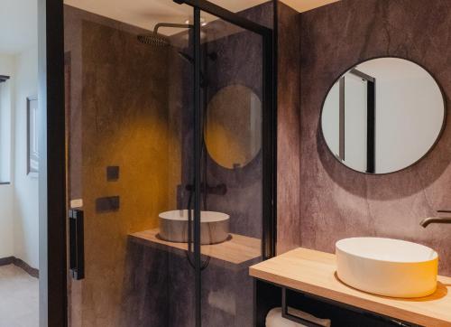 a bathroom with two sinks and a mirror at Cowool Créteil in Créteil