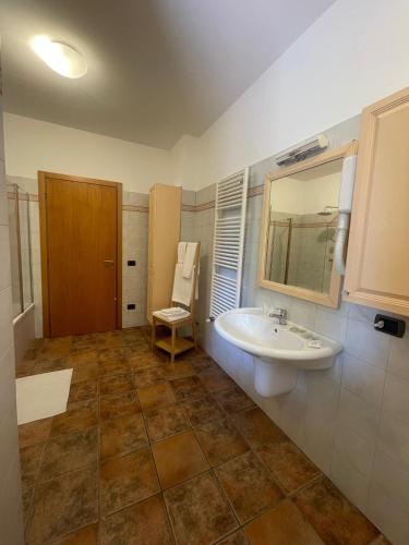 a bathroom with a sink and a mirror at La Corte delle Marche in Osimo