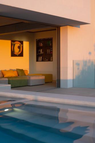 a bedroom with a bed and a swimming pool at Homey - a living space in Daratso