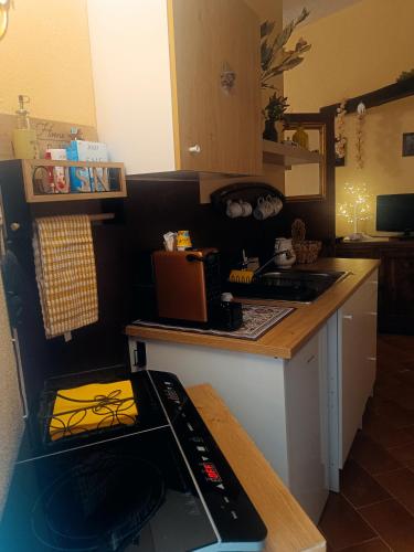 a kitchen with a stove and a counter top at Lo Chalet del Borgo in Rivisondoli