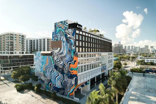 a building with a mural on the side of it at Arlo Wynwood Miami in Miami