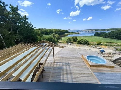 a view from the roof of a house with a deck at Seaside panorama Villa with JETLESS hot tub in Gothenburg