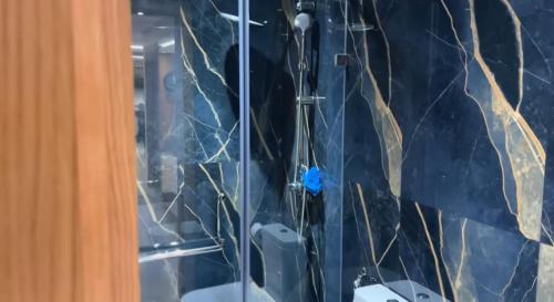 a shower in a bathroom with a glass door at YourHome in Casablanca