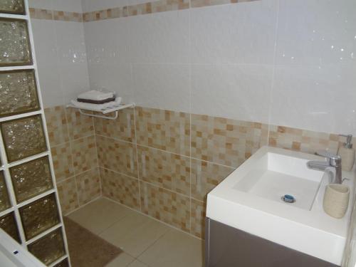 Koupelna v ubytování Villa Palulie