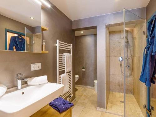 a bathroom with a sink and a shower at Studio mit Sauna in Kirchberg in Tirol