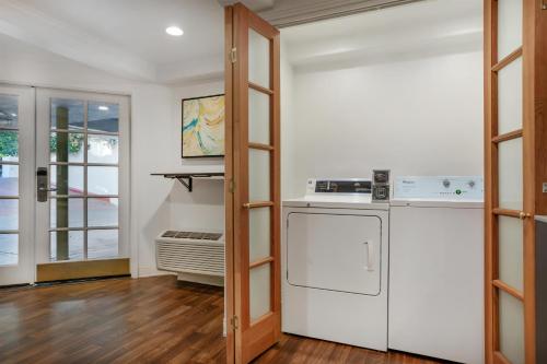 a kitchen with a white refrigerator and a stove at Best Western Plus Riviera in Menlo Park