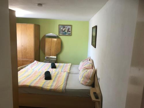 a small bedroom with a bed in a room at Landhaus Oma Gretel - Nossen, Siebenlehn, Freiberg, Meißen, Dresden, Chemnitz 