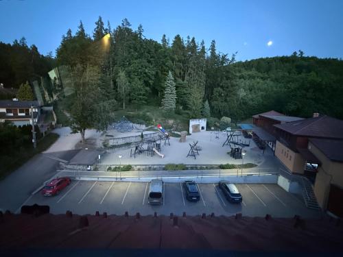 an aerial view of a parking lot with parked cars at Pokojíček 512 in Lázně Luhačovice