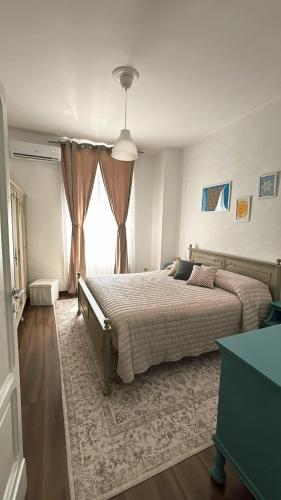 a bedroom with a large bed and a window at Casa Dolce Casa in Guardiagrele