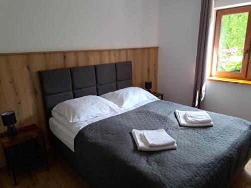 Llit o llits en una habitació de Pod Dachem Tykocin 1