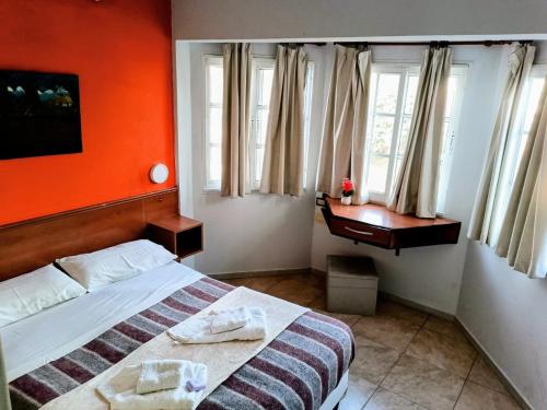 Hotel Queguay tesisinde bir odada yatak veya yataklar