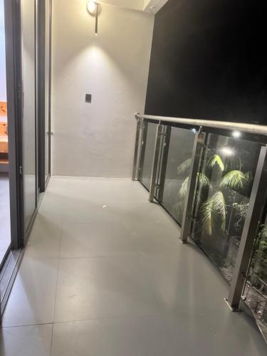 an empty hallway with an exhibit of plants at Whalesharkview in Maamigili