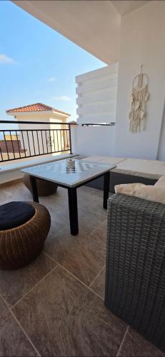 a living room with a table and a couch at Mista apartment in Peyia