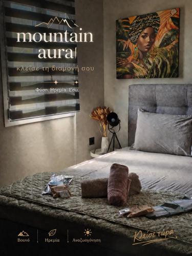 a bed with a sign that reads mountain annual at Mountain Aura - Stylish Escape in Kamarítsa