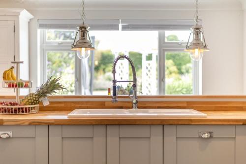 a kitchen with a sink and a window at 5 Bed in Bodham oc-2204 in Bodham