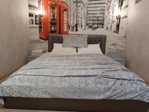 a bedroom with a large bed in a building at Luxuri apartments in Chernihiv