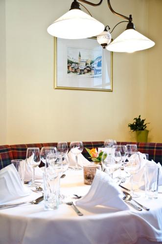 a table with wine glasses on it in a restaurant at Hotel Tannenhof in Ischgl