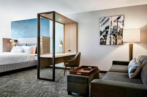 a hotel room with a bed and a desk at SpringHill Suites by Marriott Appleton in Appleton
