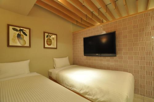 Postel nebo postele na pokoji v ubytování Hotel Mid In Kawasaki Ekimae
