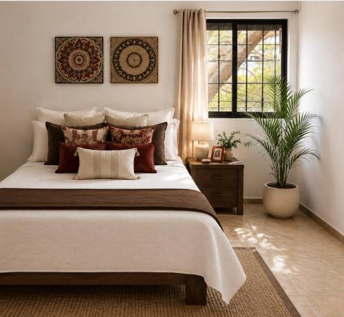 a bedroom with a large bed and a window at Morada Luna Coyoacán in Mexico City