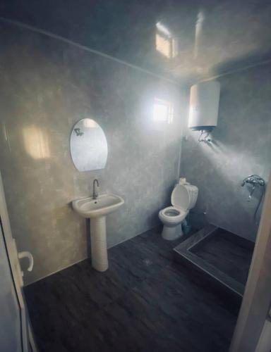 a bathroom with a sink and a toilet at Aragast White Beach in Sevan