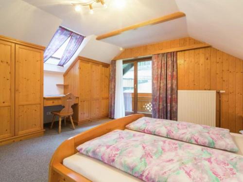 a bedroom with a bed and a desk and a window at Landhaus Rangersdorf in Rangersdorf