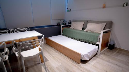 a small room with a bunk bed and a table at Montañeses 2830 Duplex Flat in Buenos Aires