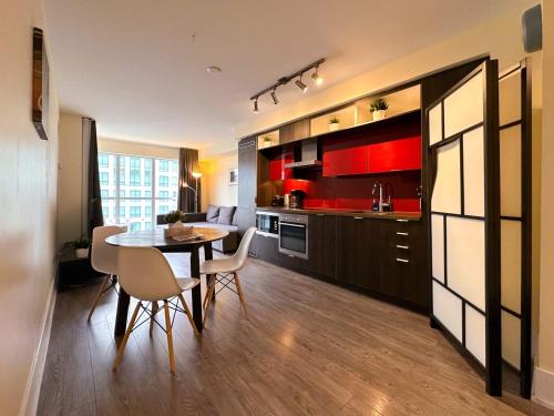 a kitchen and dining room with a table and chairs at Union Centre Hotel & Suites in Toronto