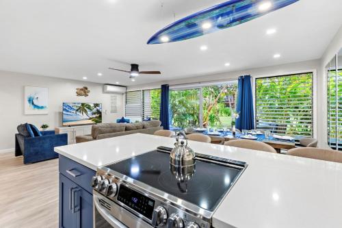 an open kitchen and living room with a dining room at Maui Sands 3C in Honokowai