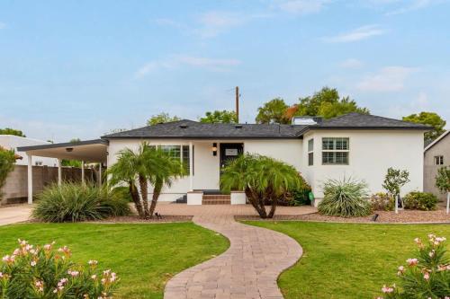 a white house with a driveway at Casa Gia- Quiet Luxury Biltmore Area - Heated Pool in Phoenix