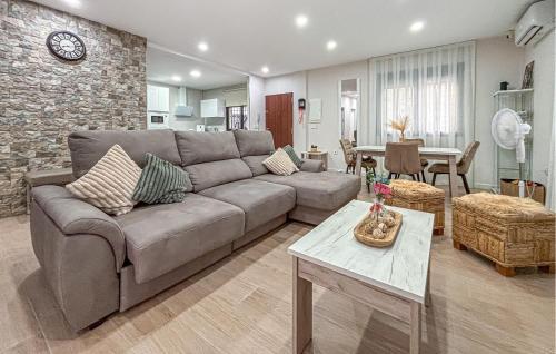 a living room with a couch and a table at Villa Villaplana in Fortuna