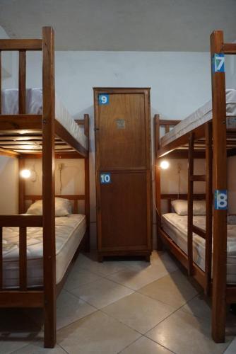 Una cama o camas en una habitación de Hostelito Hotel