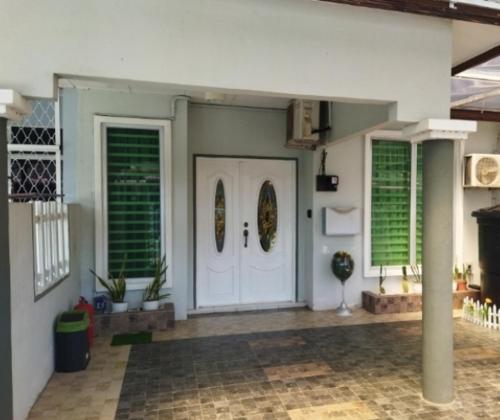 a room with a white door and two windows at Homestay 4H Perlis in Kangar