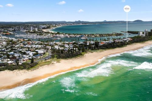 an aerial view of a beach and the ocean at Point Cartwright Penthouse - Ocean and River Views in Buddina