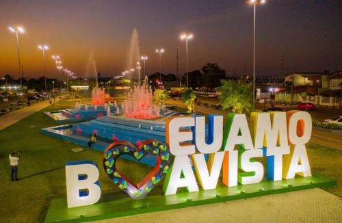 a sign that says eurozone brazil in front of a fountain at Nômade no Liberdade 01 in Boa Vista