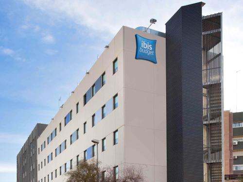 a building with a sign on the side of it at Ibis Budget Málaga Centro in Málaga