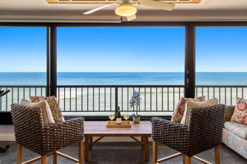 a living room with a view of the ocean at Maui Kai 405 in Honokowai