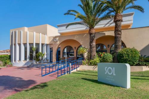 a building with a sign in front of it at SOL by Meliá Sancti Petri in Chiclana de la Frontera