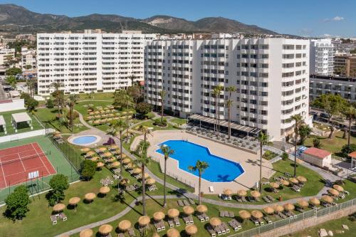 an aerial view of a large building with a tennis court at SOL by Meliá Puerto Marina in Torremolinos