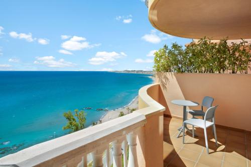 a balcony with a view of the ocean at Holiday World Casamaïa Apartments, Affiliated by Meliá in Benalmádena