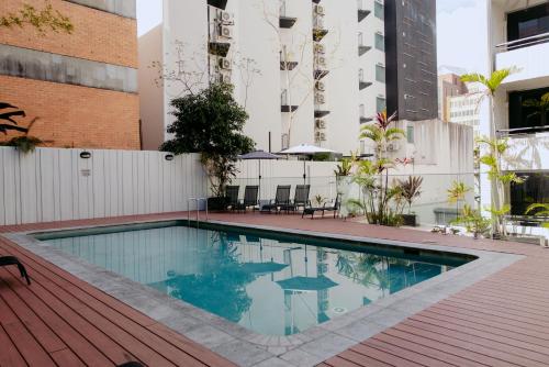 a swimming pool on top of a building at Punthill Spring Hill in Brisbane