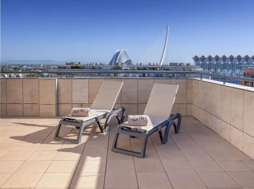 two chairs sitting on the roof of a building at INNSiDE by Meliá Valencia Oceanic in Valencia