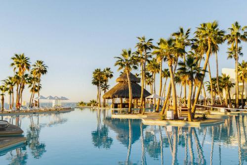 a resort with palm trees and a swimming pool at Paradisus by Meliá Los Cabos - Adults Only - All Inclusive in San José del Cabo