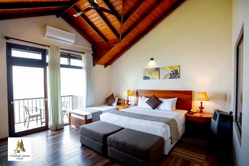 a hotel room with two beds and a balcony at Marabedda Gardens Resort in Rikillagaskada