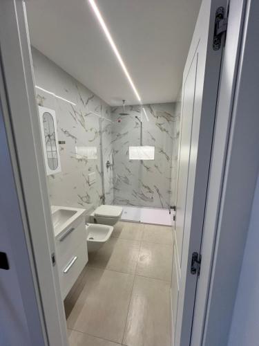 a bathroom with a toilet and a sink at Vista Mare in Cipressa