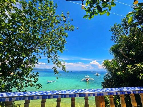 a view of the ocean from a resort balcony at FFG Eden Private Resort in Basdiot