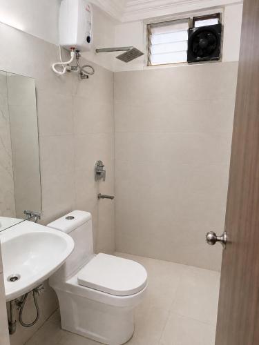 a bathroom with a toilet and a sink at Beach Resort in 1 in North goa