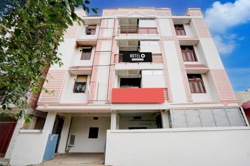a pink building with a sign on it at Hotel O Patel Nagar Patna Formerly Princess Home in Patna